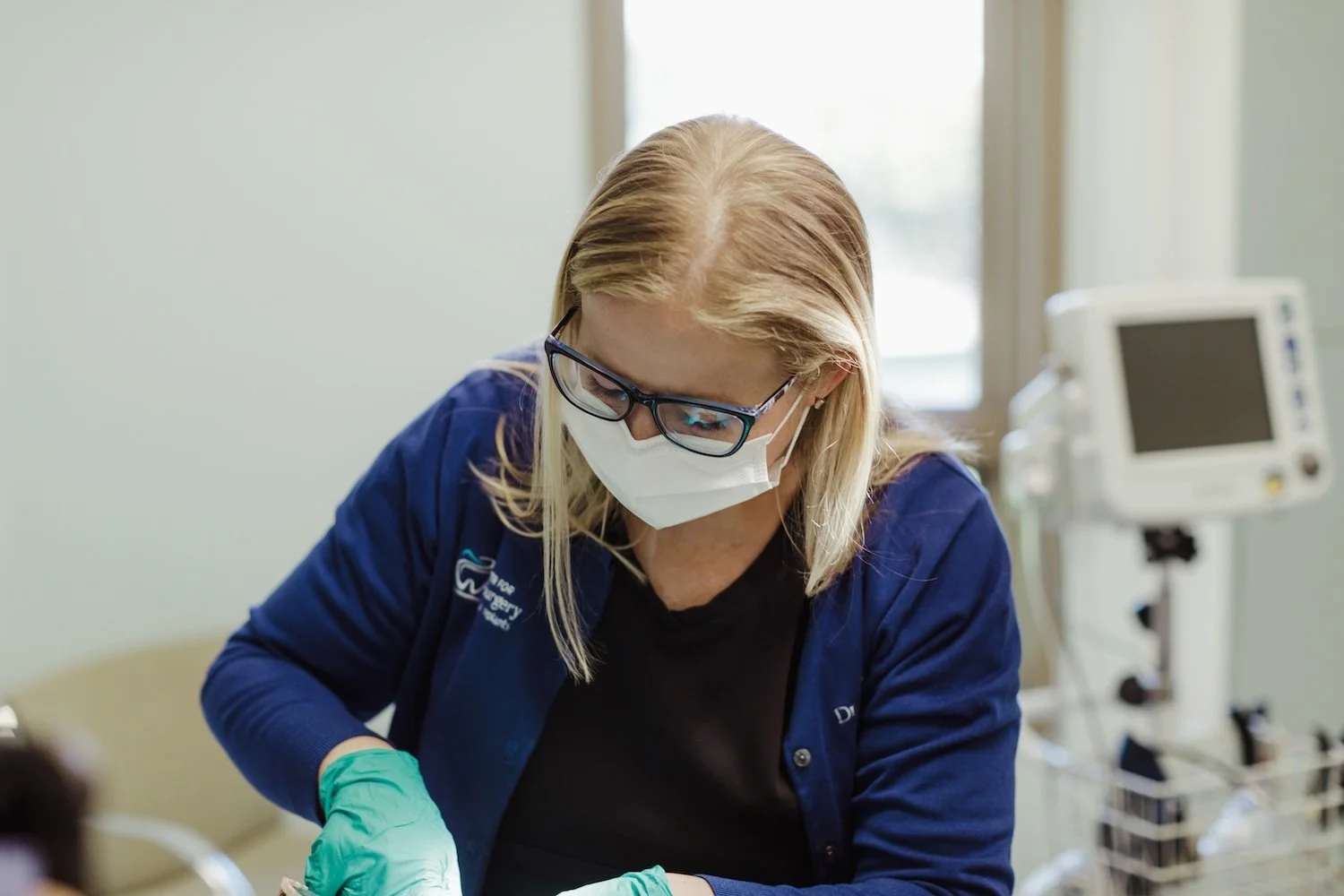 Dr. Noordhoek treats a patient at the Center for Oral Surgery + Dental Implants