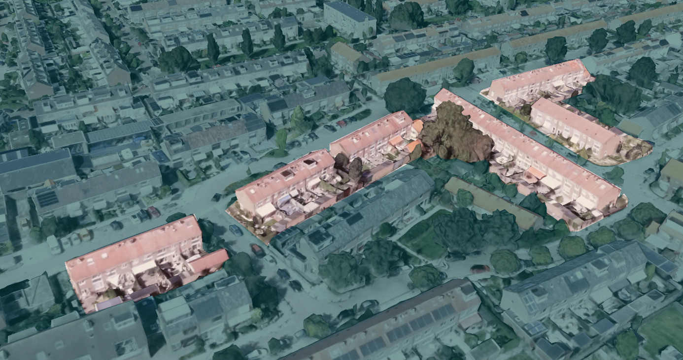 Aerial view of a residential neighborhood featuring four rows of townhouses with red-tiled roofs, parking areas, trees, and surrounding houses.