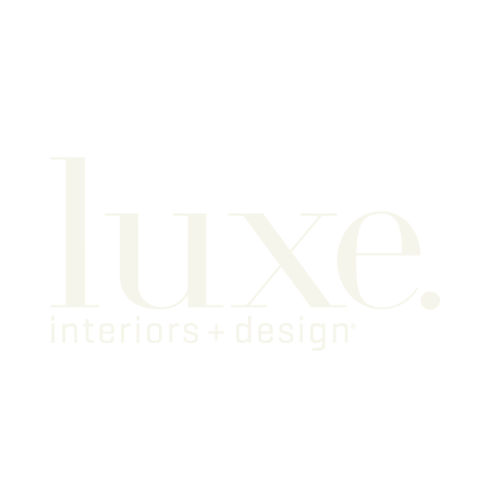 Luxe Interiors + Design logo in light beige on a white background.