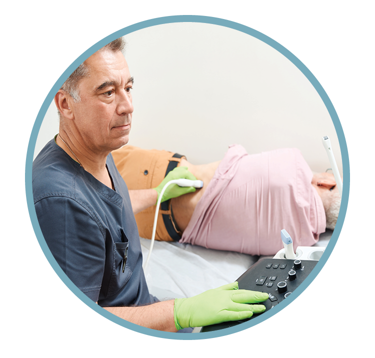 A medical professional conducting an ultrasound on an older male patient lying on a bed, with the medical device in his hand and the patient in casual clothing.