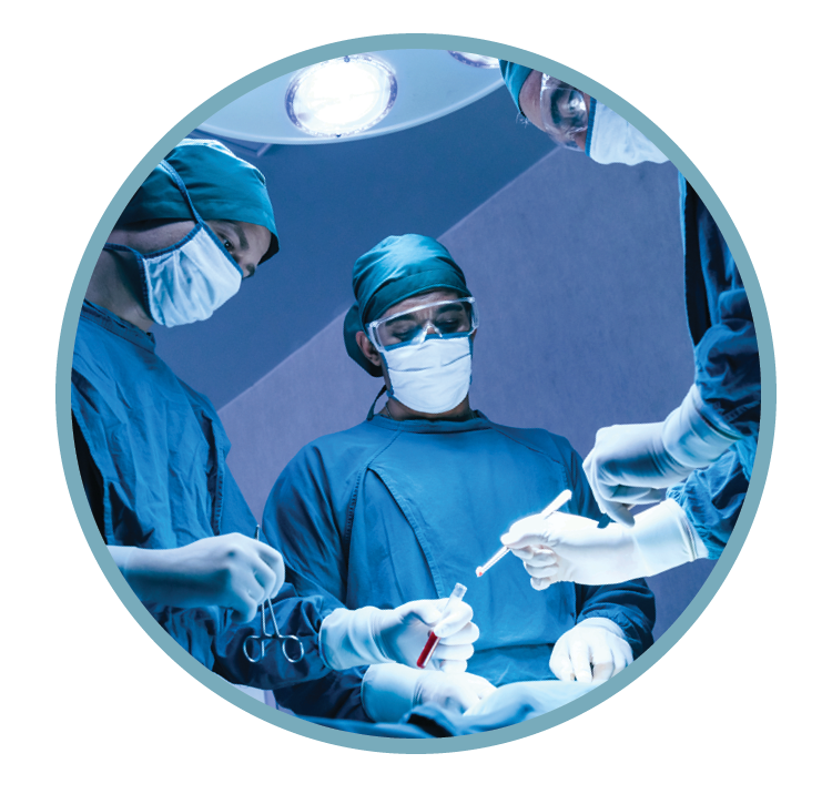 Surgeons in operating room performing surgery, wearing scrubs, masks, and gloves.