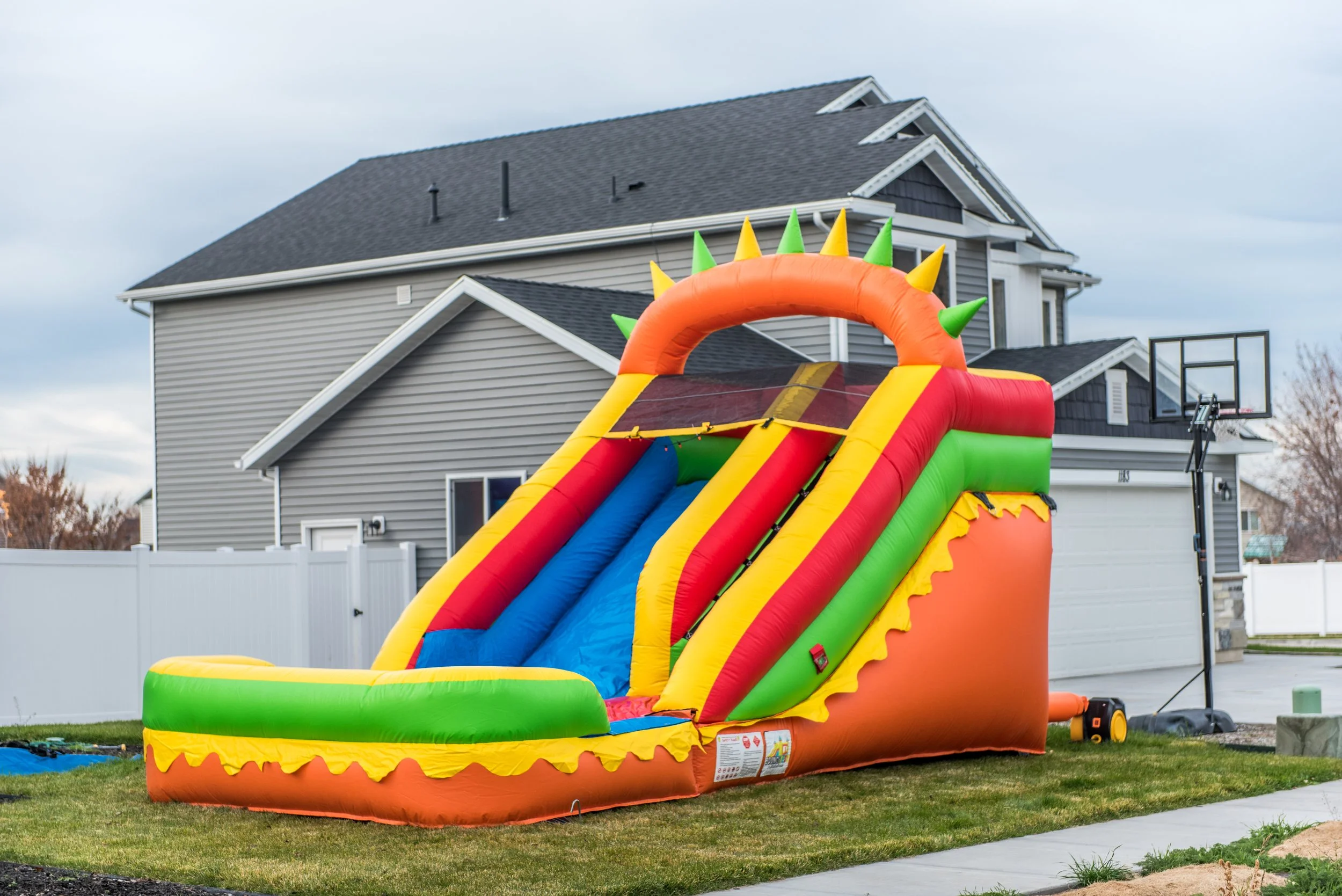 Always Bouncin' Utah's Sunshine 14-Foot Slide is the perfect addition to any outdoor party, bringing hours of fun and excitement!