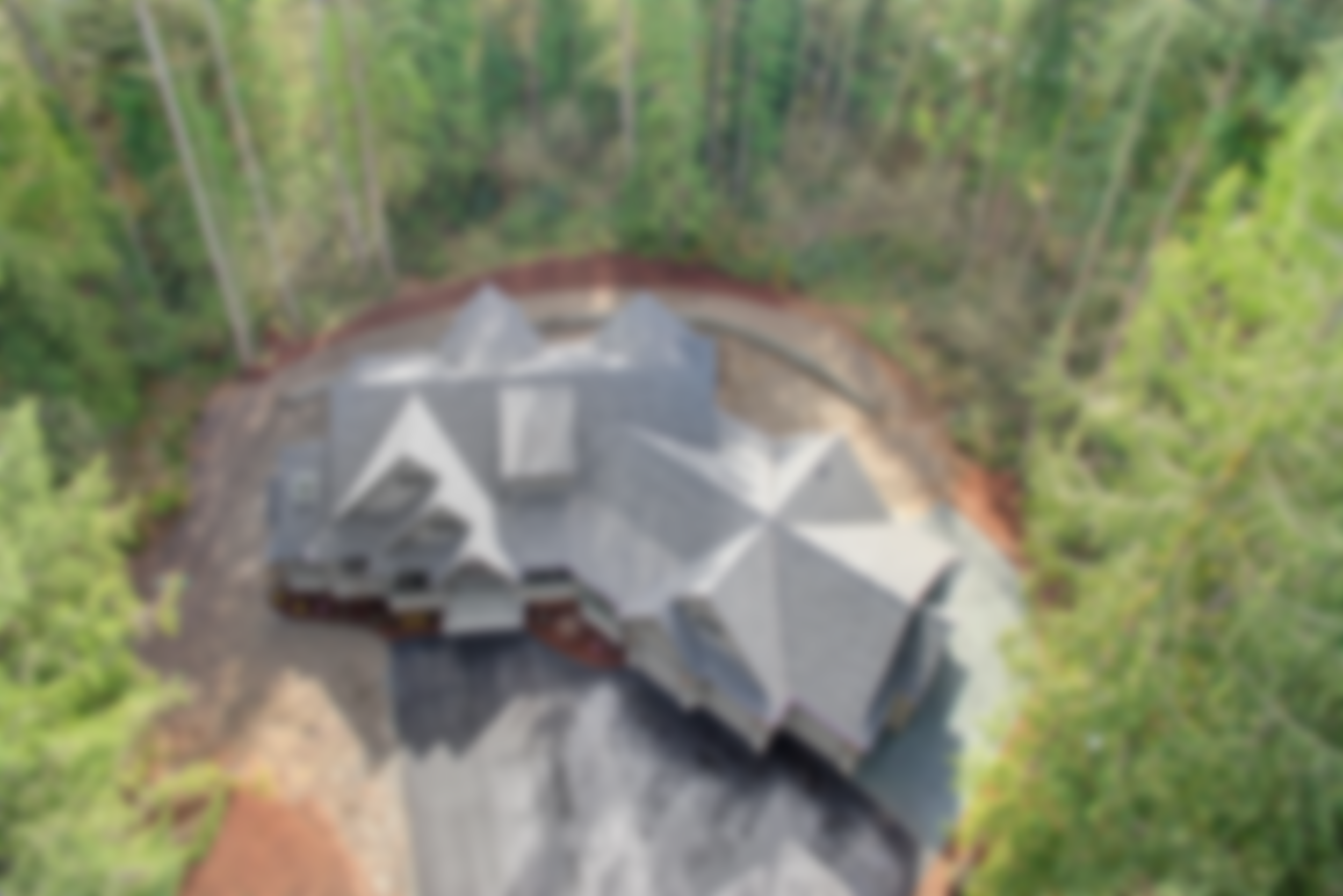 Expert custom home construction by Agnew Homes Northwest in Snohomish, WA, featuring a complex roofline design and high-performance building standards for ultimate durability.