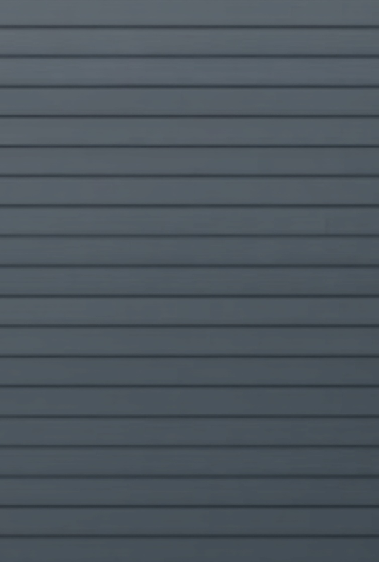 Pristine fiber cement siding installation on a high-performance custom home for superior curb appeal and durability.