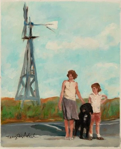 A woman and a young girl walking with a black dog beside a windmill and grassy field on a sunny day.