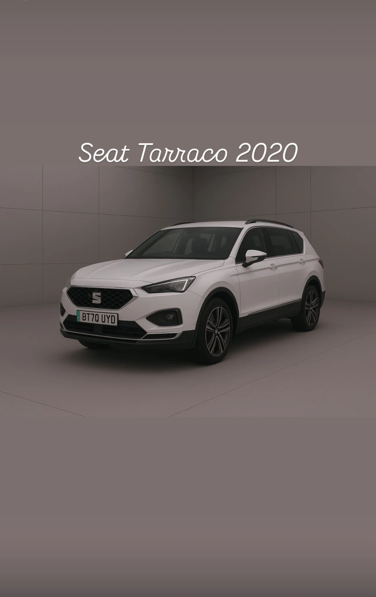 White SEAT Tarraco SUV parked in a neutral-colored room with the text 'Seat Tarraco 2020' above it.