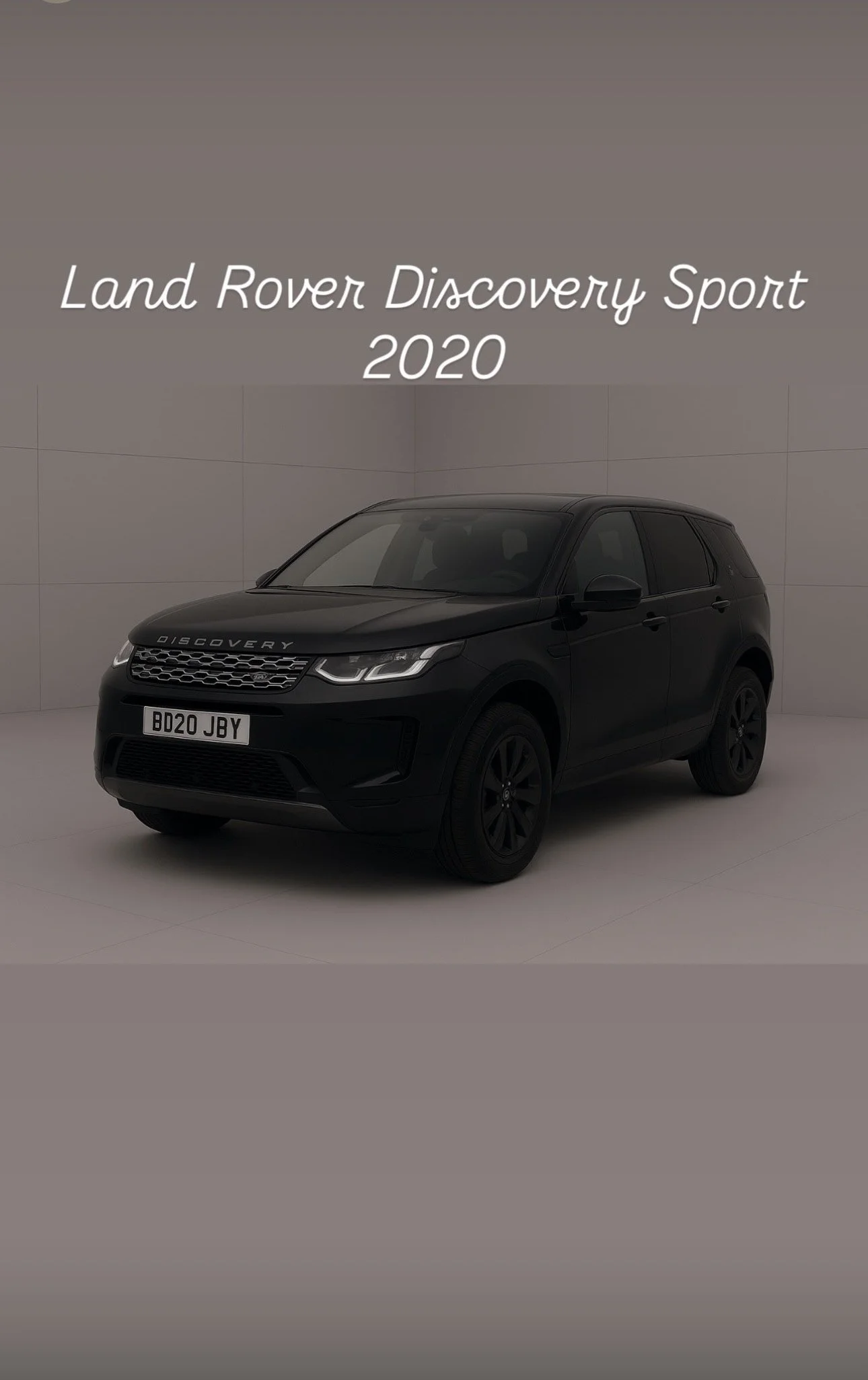 Black Land Rover Discovery Sport 2020 in studio with text overlay