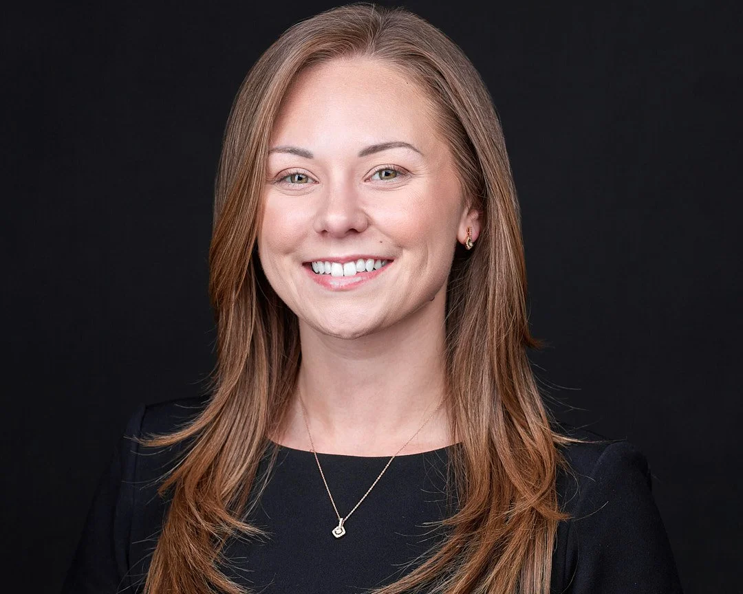 Headshot of a female attorney wearing a black dress