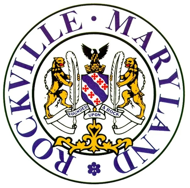 Rockville Maryland logo with two lions, a shield, and an eagle crest in the center, encircled by the words 'Rockville Maryland.'