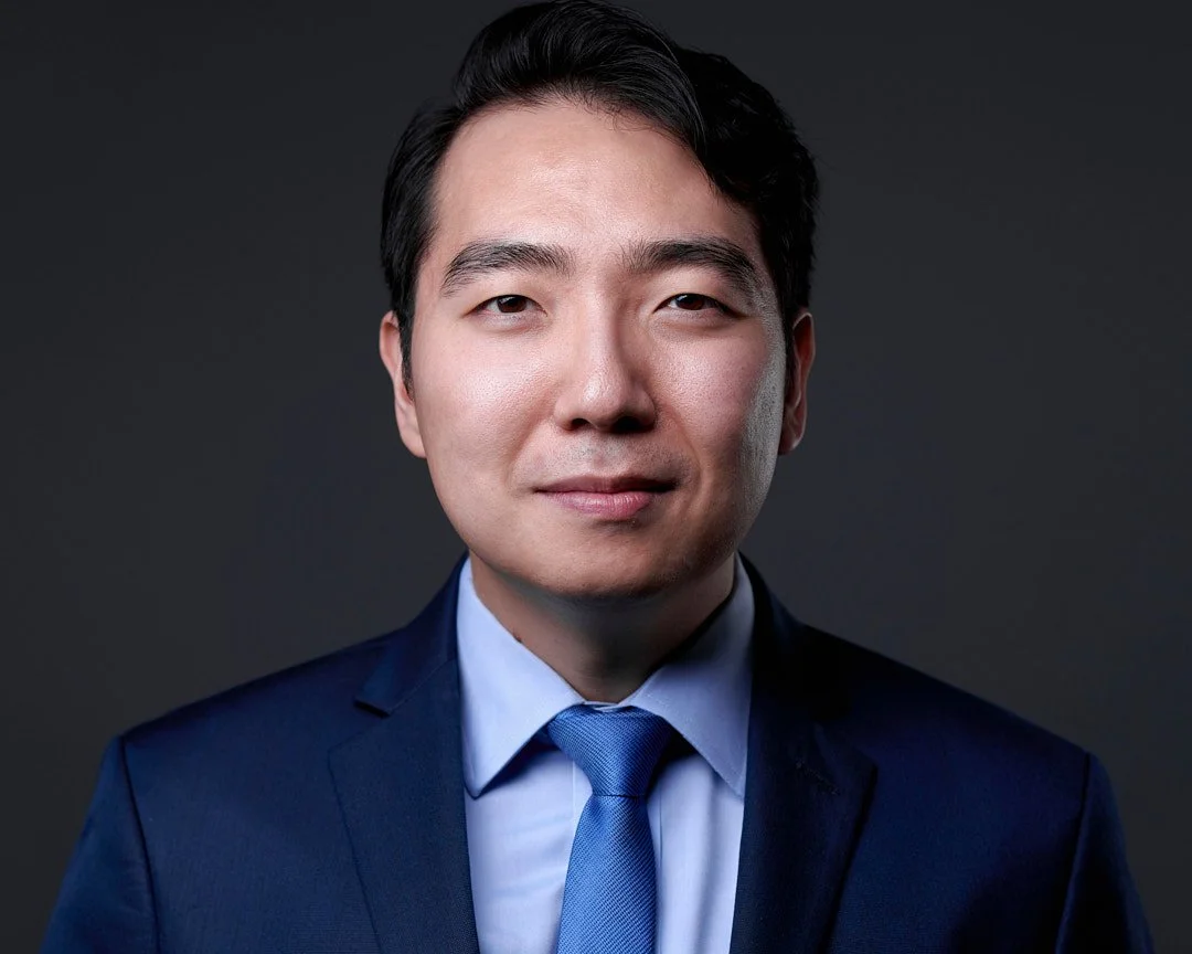 Headshot of a male lawyer wearing a blue blazer shirt and tie in my clarksburg studio