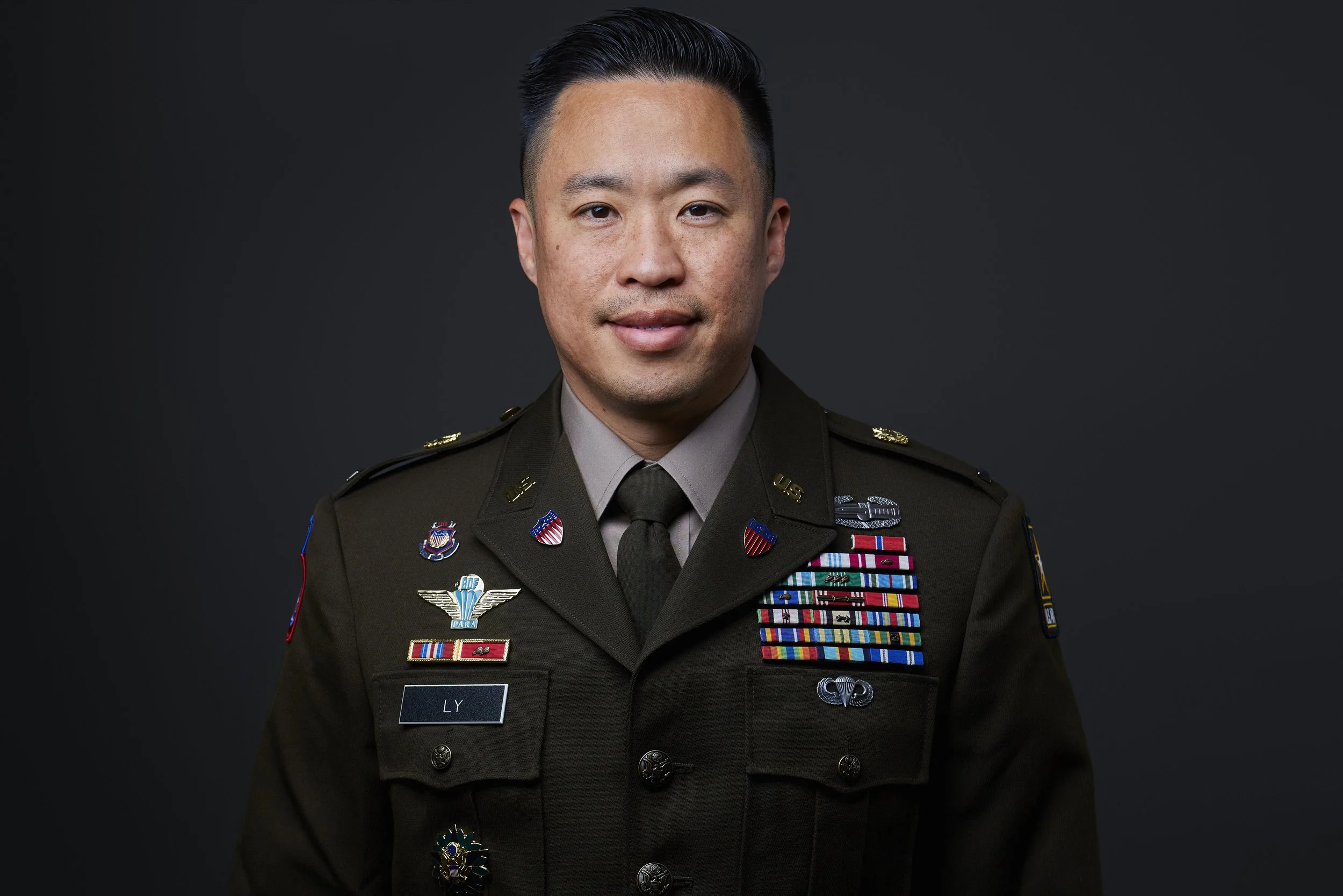 Person in U.S. military uniform with badges and name tag