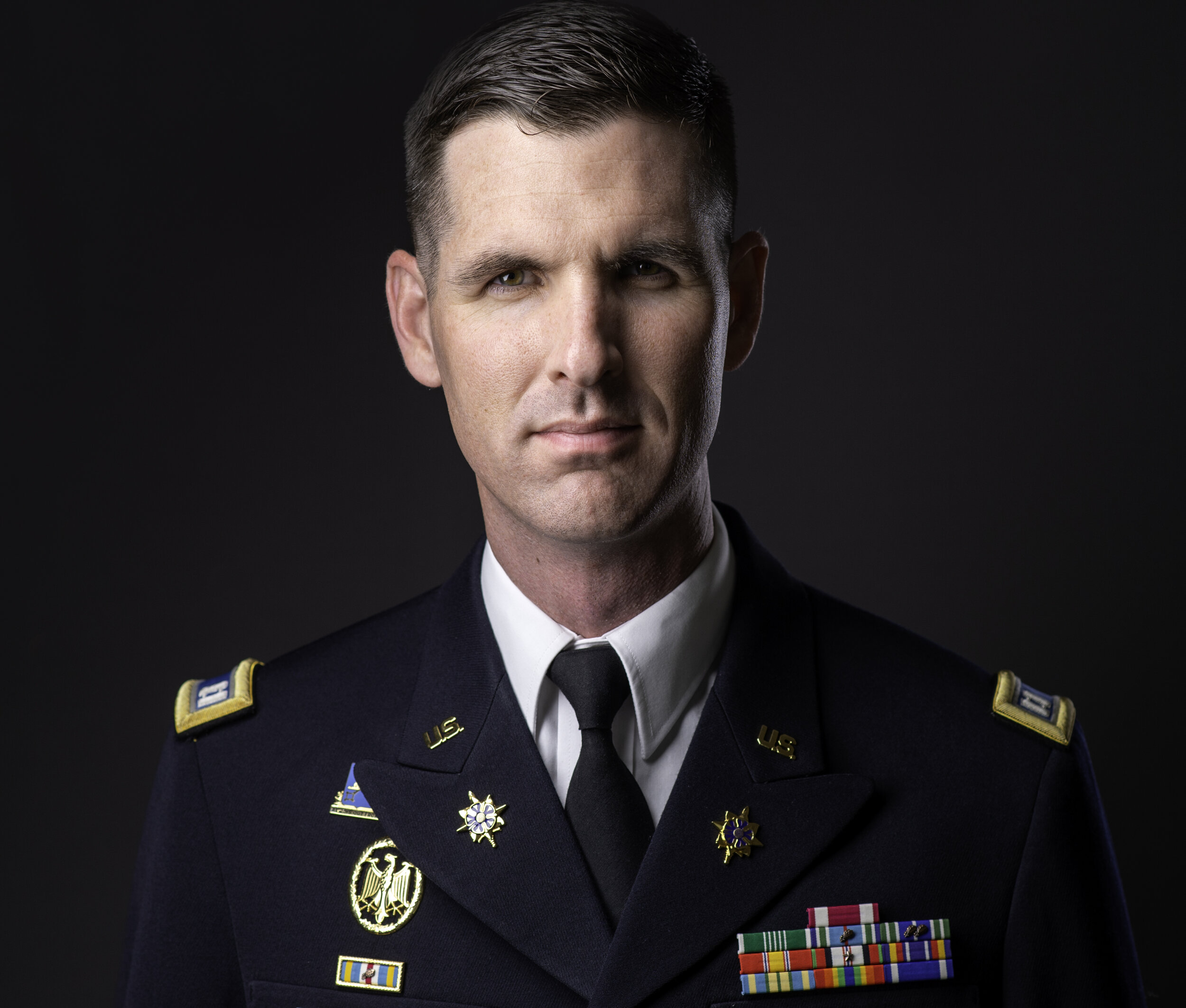 Man in military uniform with medals and insignia