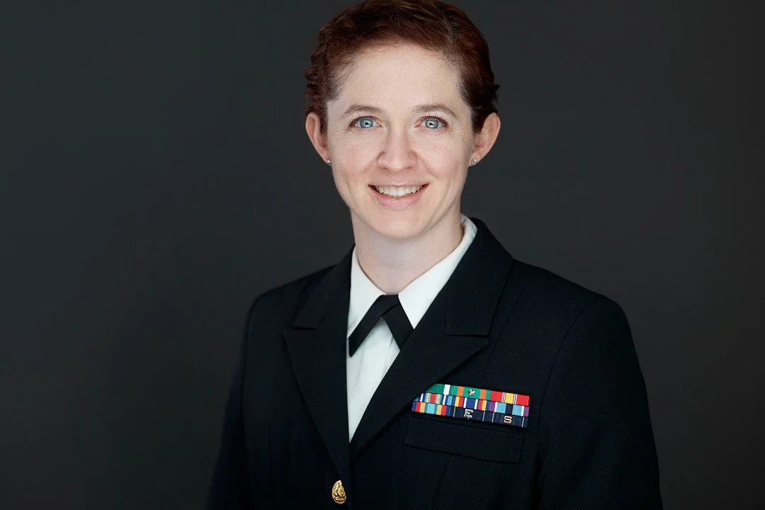 Headshot of a female nursing student wearing dress navy uniform