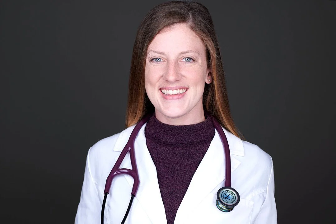 Headshot of a doctor wearing her white coat and a stethoscope around her neck