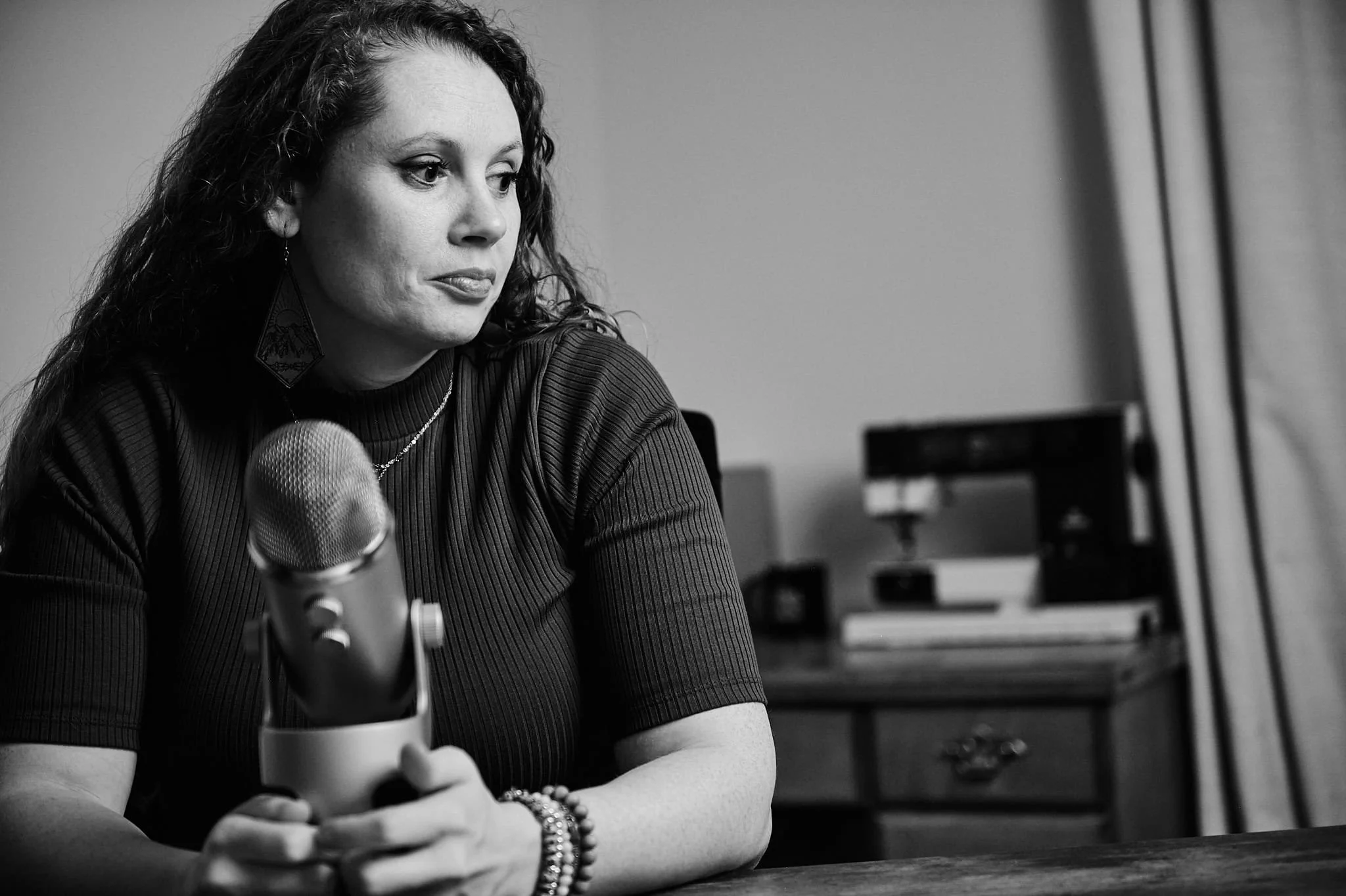 Personal branding photo for a military vet shown with her podcasting gear
