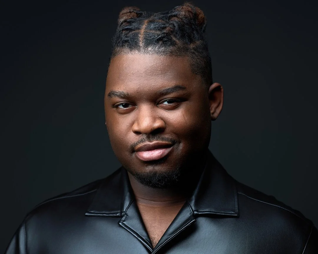 Headshot of an african american actor wearing a black leather jacket