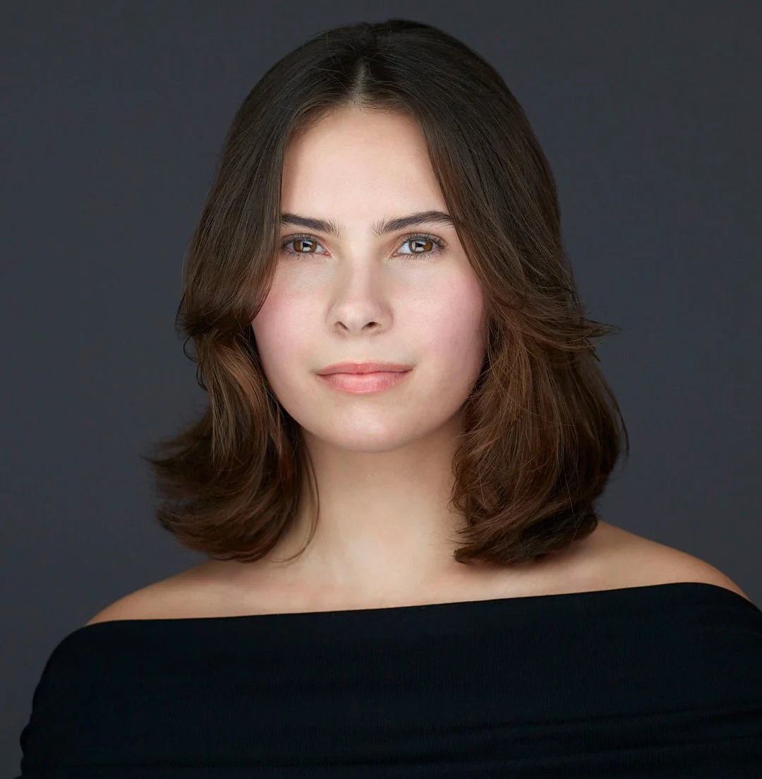 Headshot of a female actress wearing a black sweater