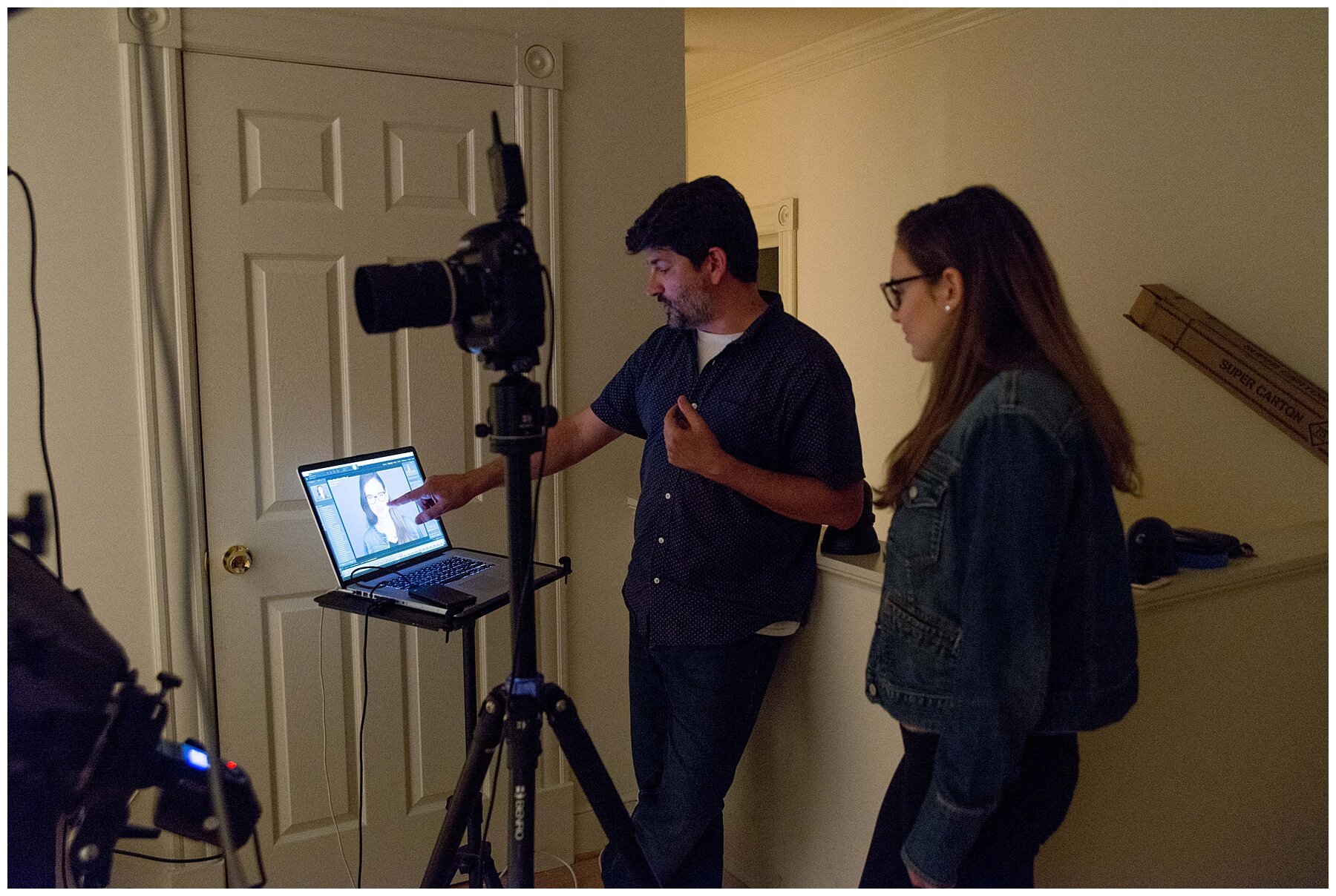 Reviewing images with a female client in my clarksburg studio