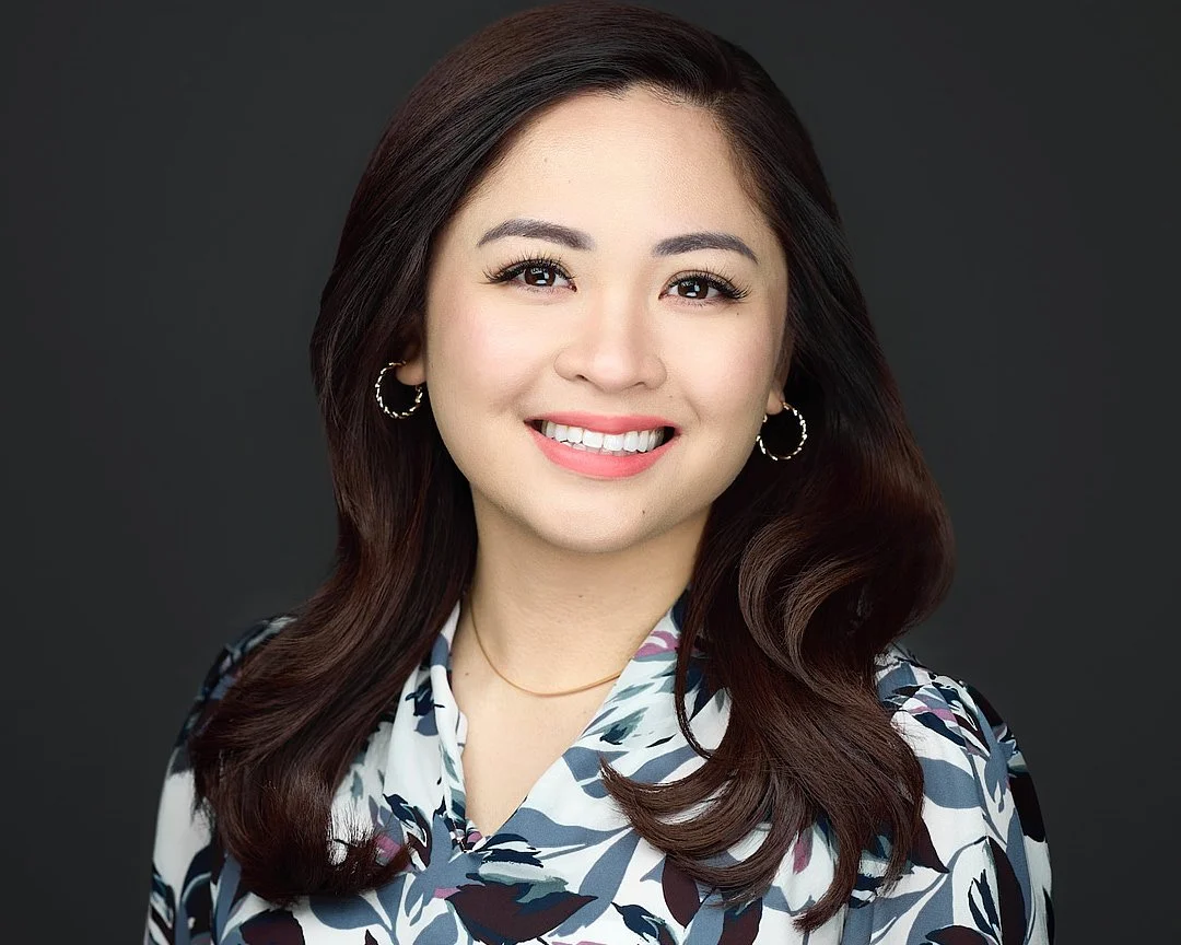LinkedIn Headshot of an Asian woman wearing a flowered blouse
