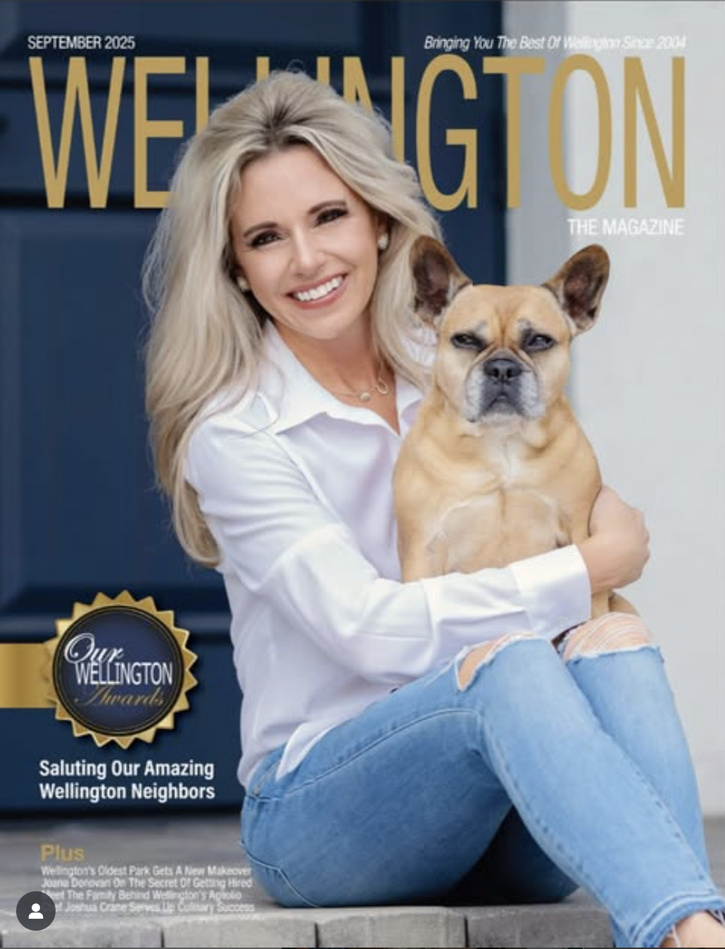A smiling woman with long blonde hair, wearing a white shirt and ripped jeans, sitting on the ground next to a small tan dog with a serious expression. They are on the cover of Wellington magazine, September 2025 issue.