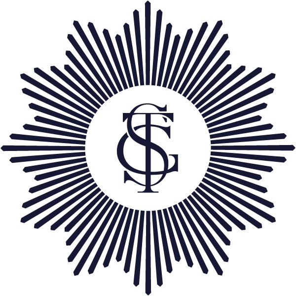 A dark emblem featuring a central circular logo with overlapping initials 'G', 'F', and 'S', surrounded by radial lines creating a starburst pattern.