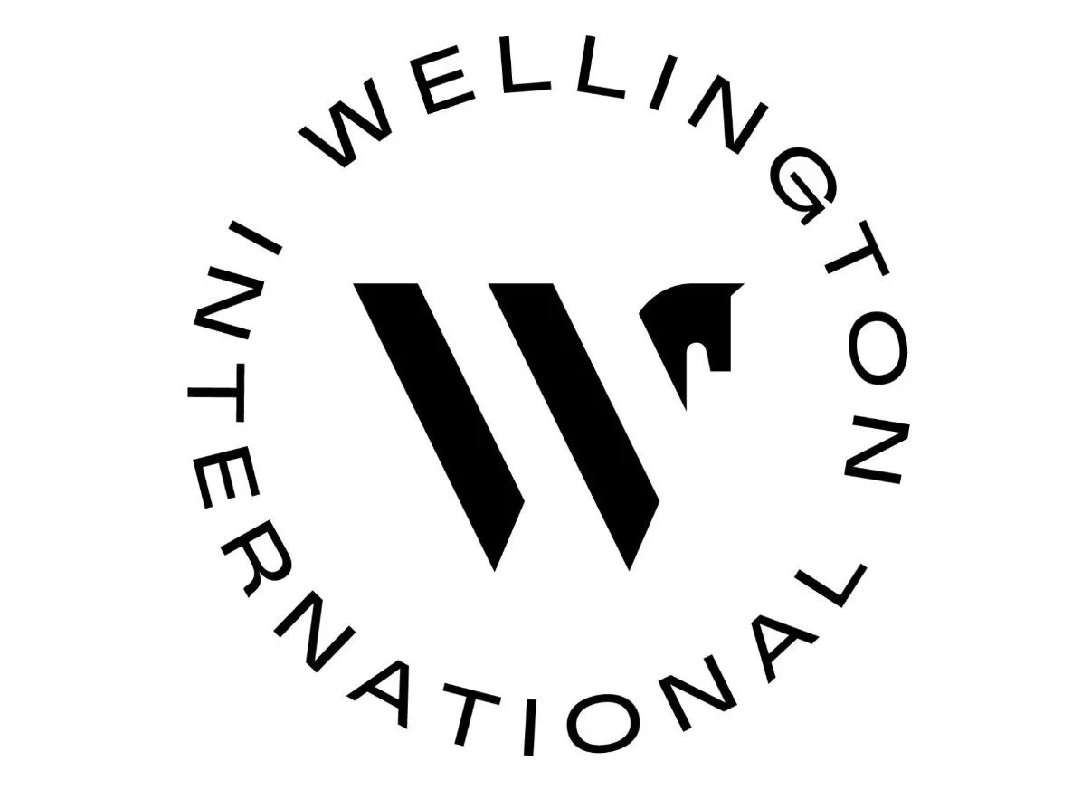 A dressage rider riding a horse at a dressage festival, with a white logo of a horse's head and the words 'Global Dressage Festival' overlayed.