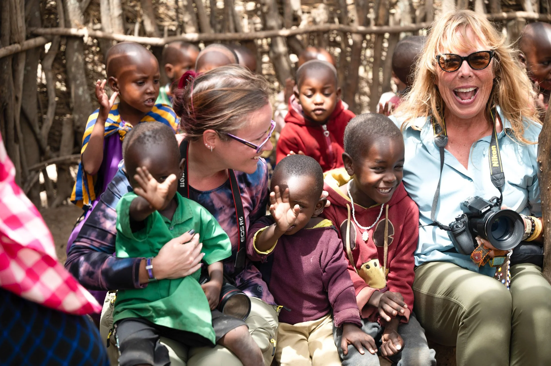 Caravan Gallery in La Conner, WA - Owner Linda with young Maasai children in a school in Tanzania 