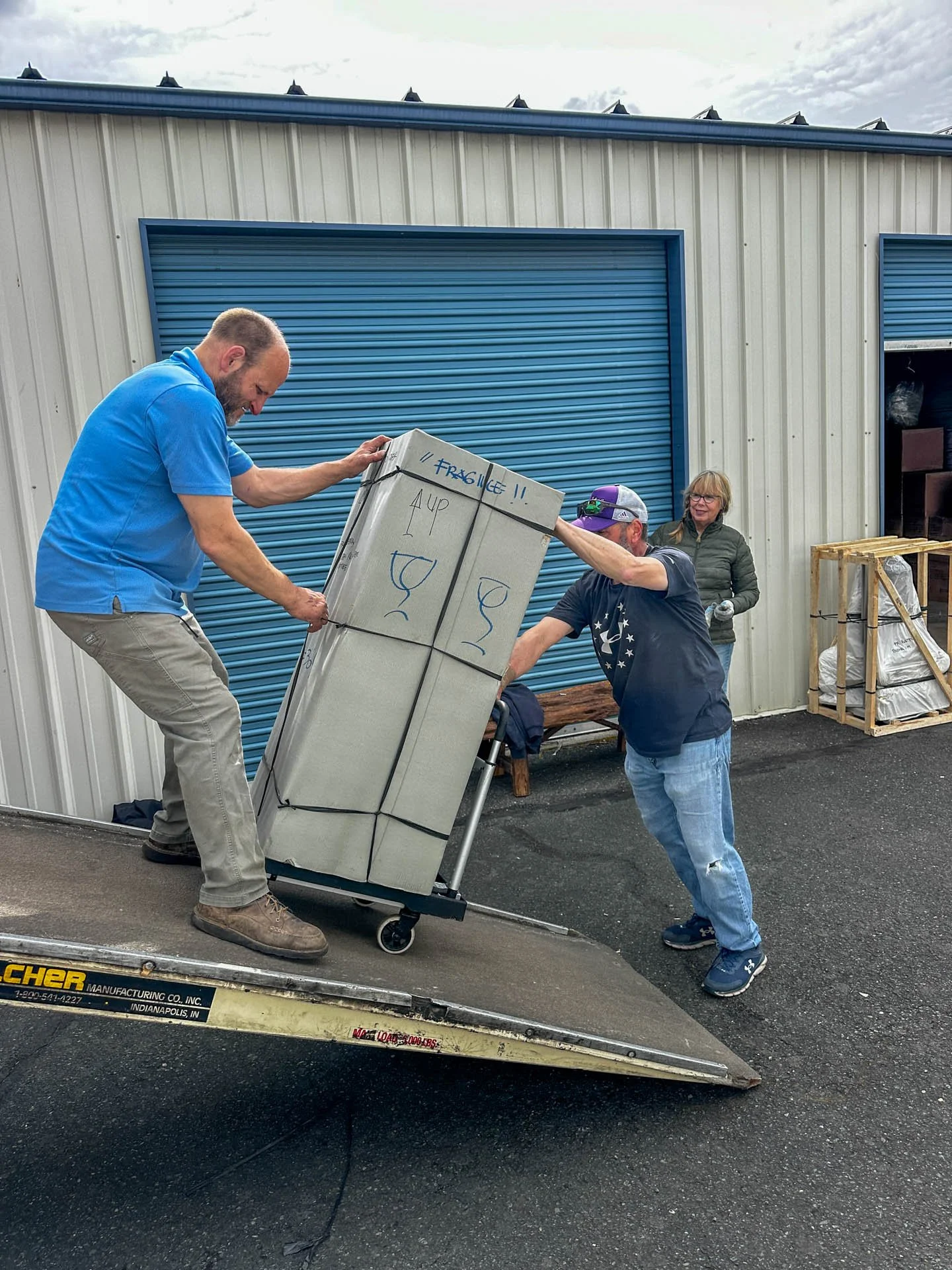 Caravan Gallery in La Conner, WA - Owner Linda Banaszak supervising unloading of a container destined for her store. 