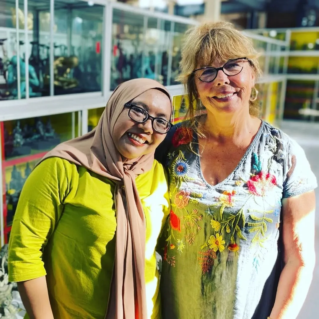 Caravan Gallery in La Conner, WA - Owner Linda purchasing from a shop in Bali. 