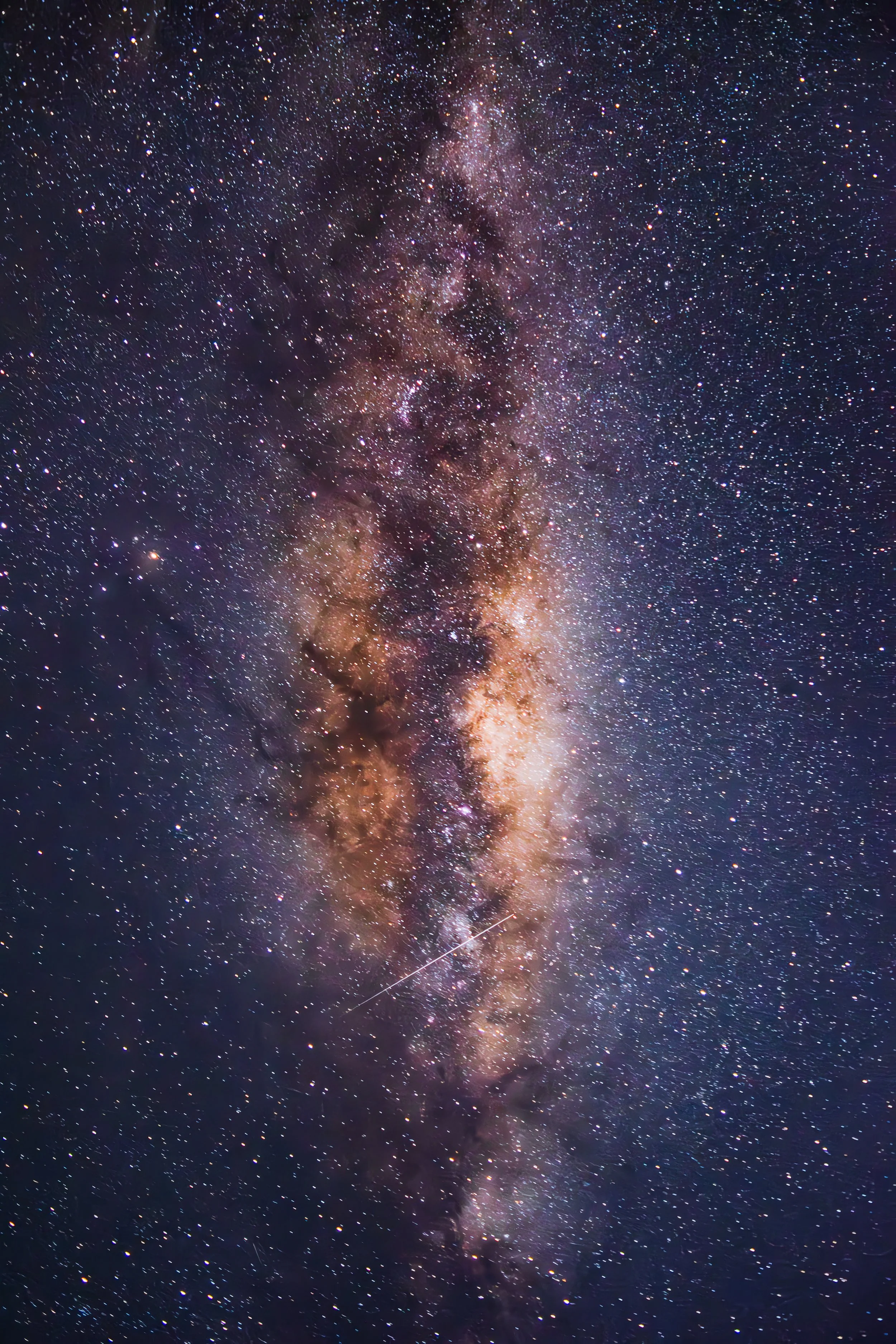 Photograph of the night sky with countless stars and the Milky Way galaxy visible.
