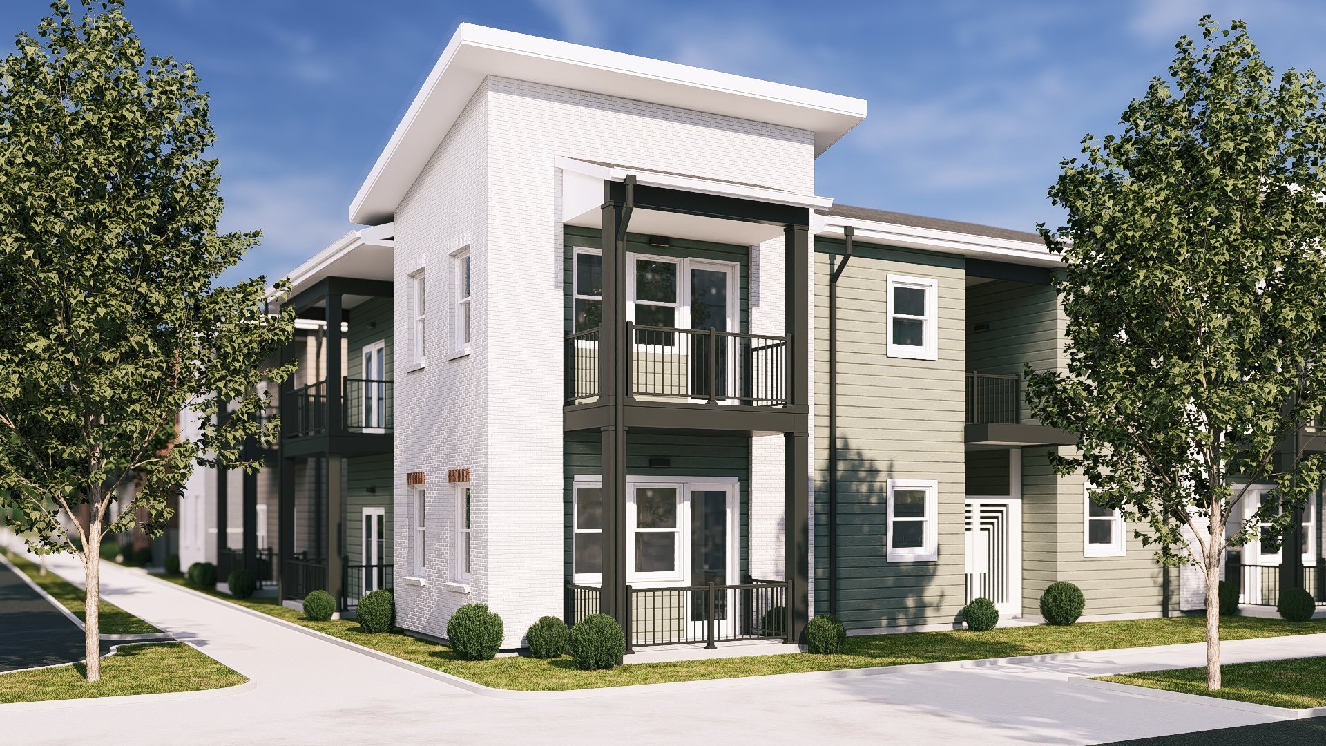 A modern, two-story residential building with white and olive-green siding, featuring small balconies with black railings, surrounded by green grass, bushes, and trees, under a blue sky.