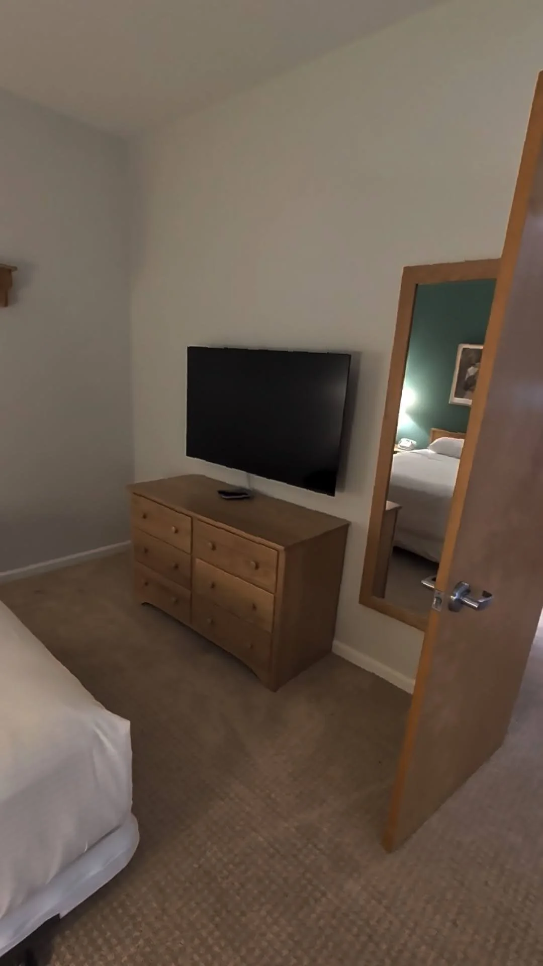2nd Bedroom has two twin beds and one queen bed and smart TV