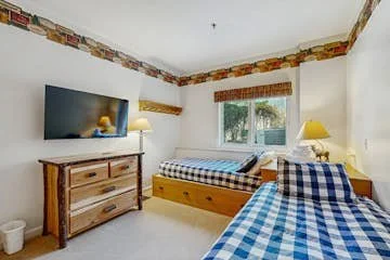 The 'bunk room' has a queen size bed, two twin beds and a smart TV