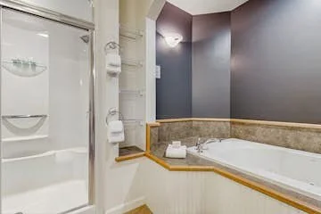 The Master Bath has a Jacuzzi tub and a two-person steam shower.