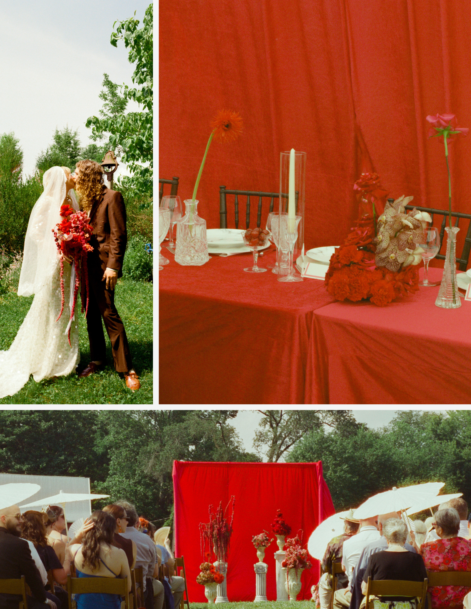 A wedding ceremony outdoors with a bride and groom standing and kissing in a garden with trees and a blue sky, a decorated red backdrop behind the altar, and guests seated watching, some holding umbrellas, with floral arrangements and white columns in front of the backdrop.