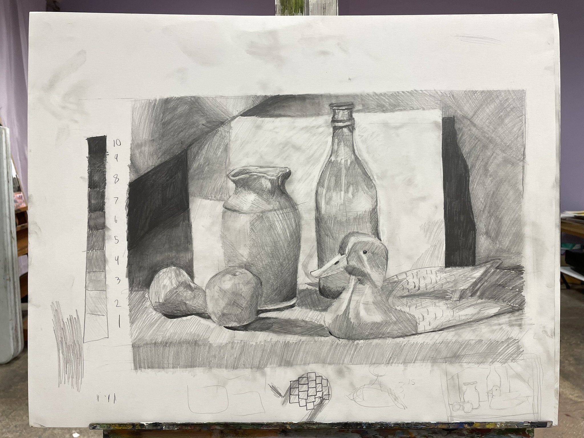 A detailed pencil drawing of still life objects, including two apples, a small pitcher, a bottle, a duck-shaped rubber toy, and a sugar loaf, with shadowed background and measurements on the left side.