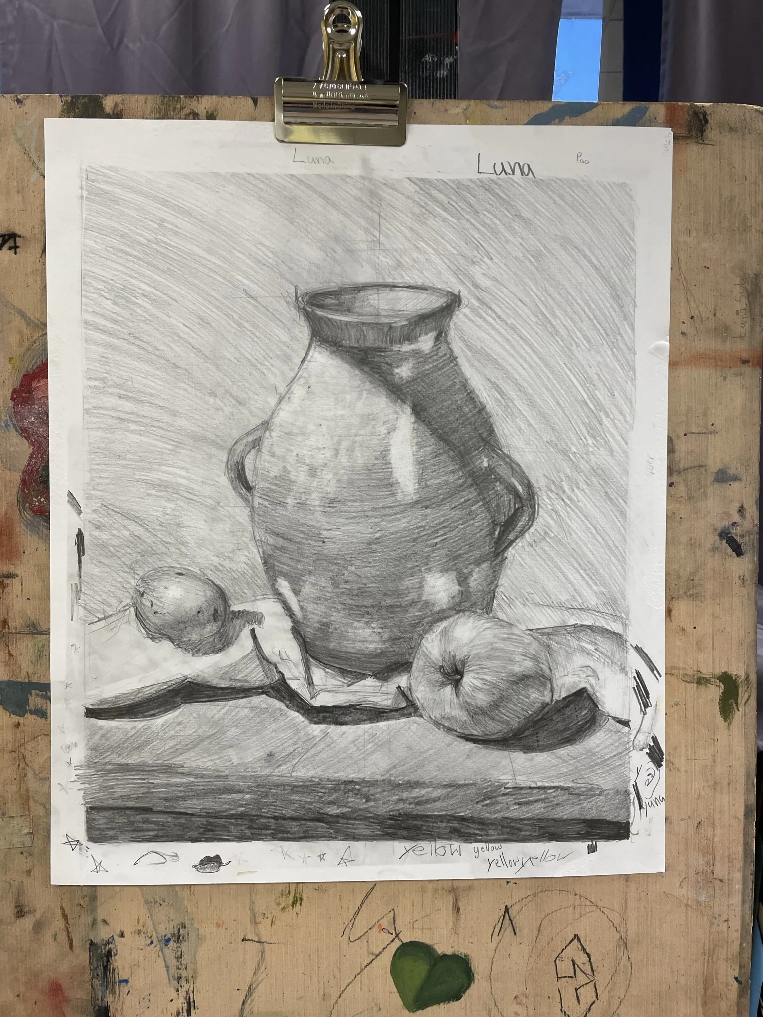 A black and white pencil sketch of a still life composition featuring a large vase in the center with two fruits, possibly apples, placed at its base.