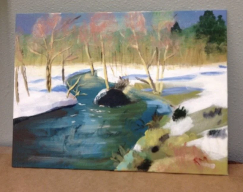 Watercolor landscape painting of a river flowing through snow-covered banks, with leafless trees and evergreen trees in the background, under a blue sky.