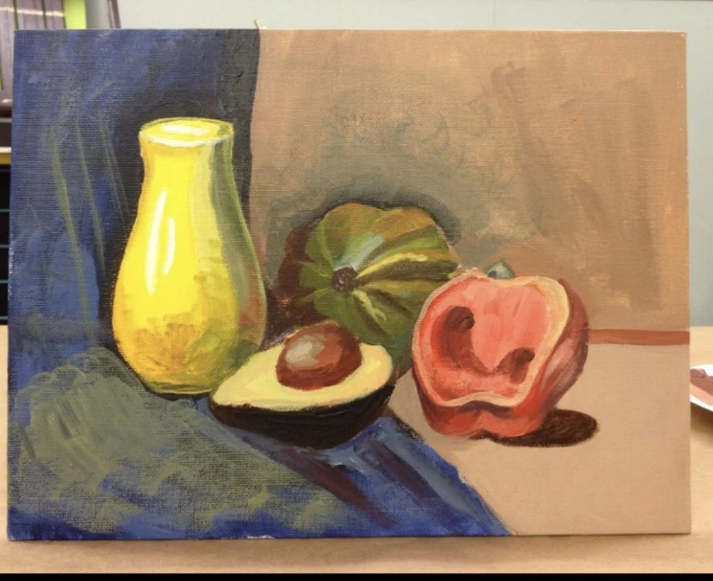 Still life painting of a yellow vase, halved avocado with pit, green pumpkin, and a sliced open peach on a multicolored surface.
