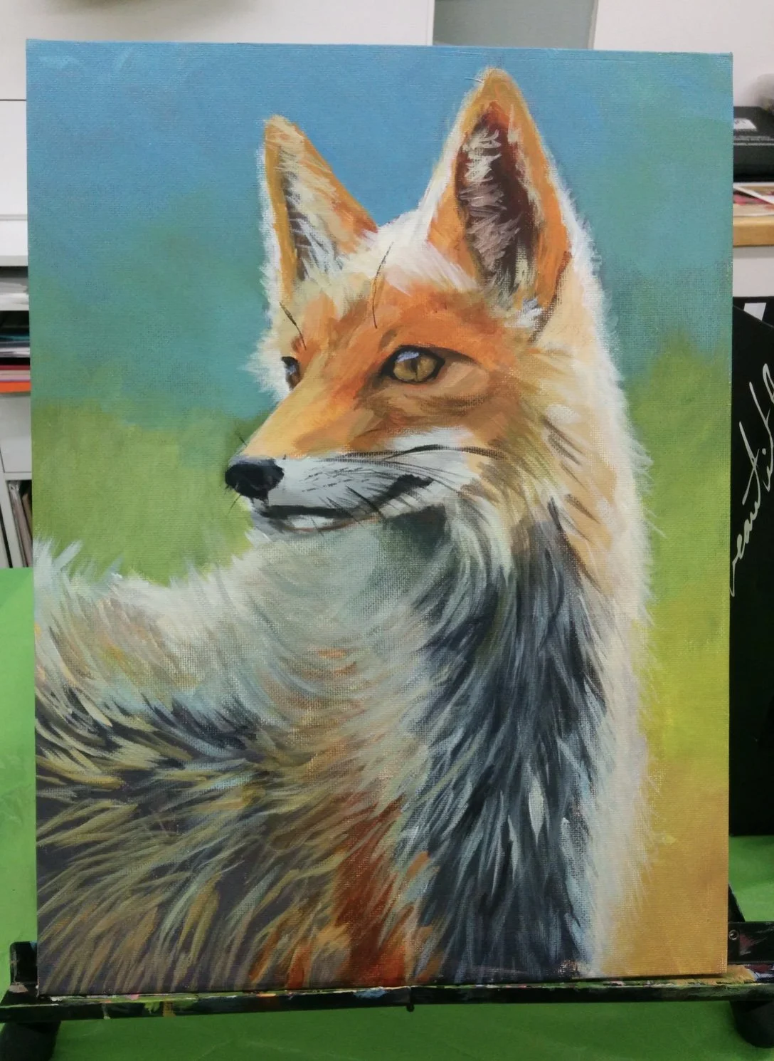 Colorful painting of a fox with a bright blue background and green foreground.