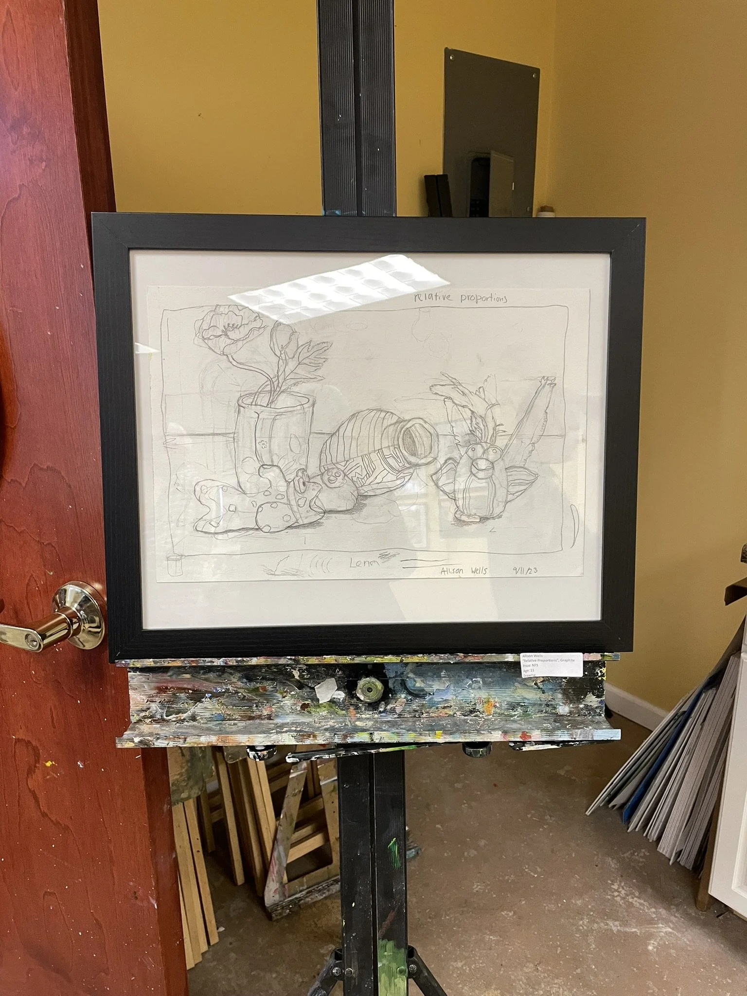 Sketch of a still life featuring a potted plant, a hollowed-out shell, a small animal figurine, and other objects, labeled 'relative proportions' and 'long,' with artist's name Allison Wells and date 9/11/23.