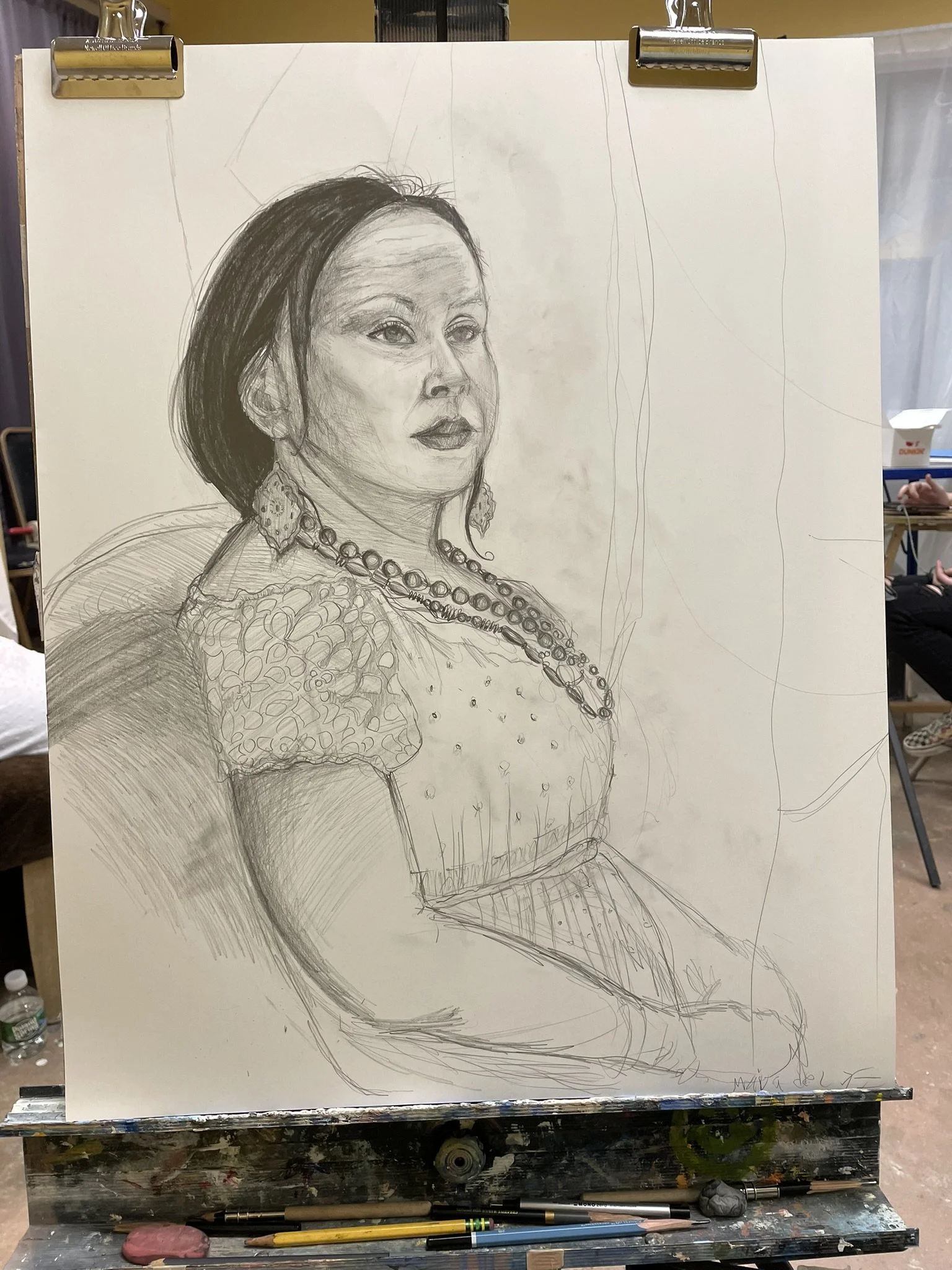 A sketch of a woman sitting on a chair, wearing earrings, a necklace, and earrings, with detailed facial features and hair, in progress with some lines and shading visible.