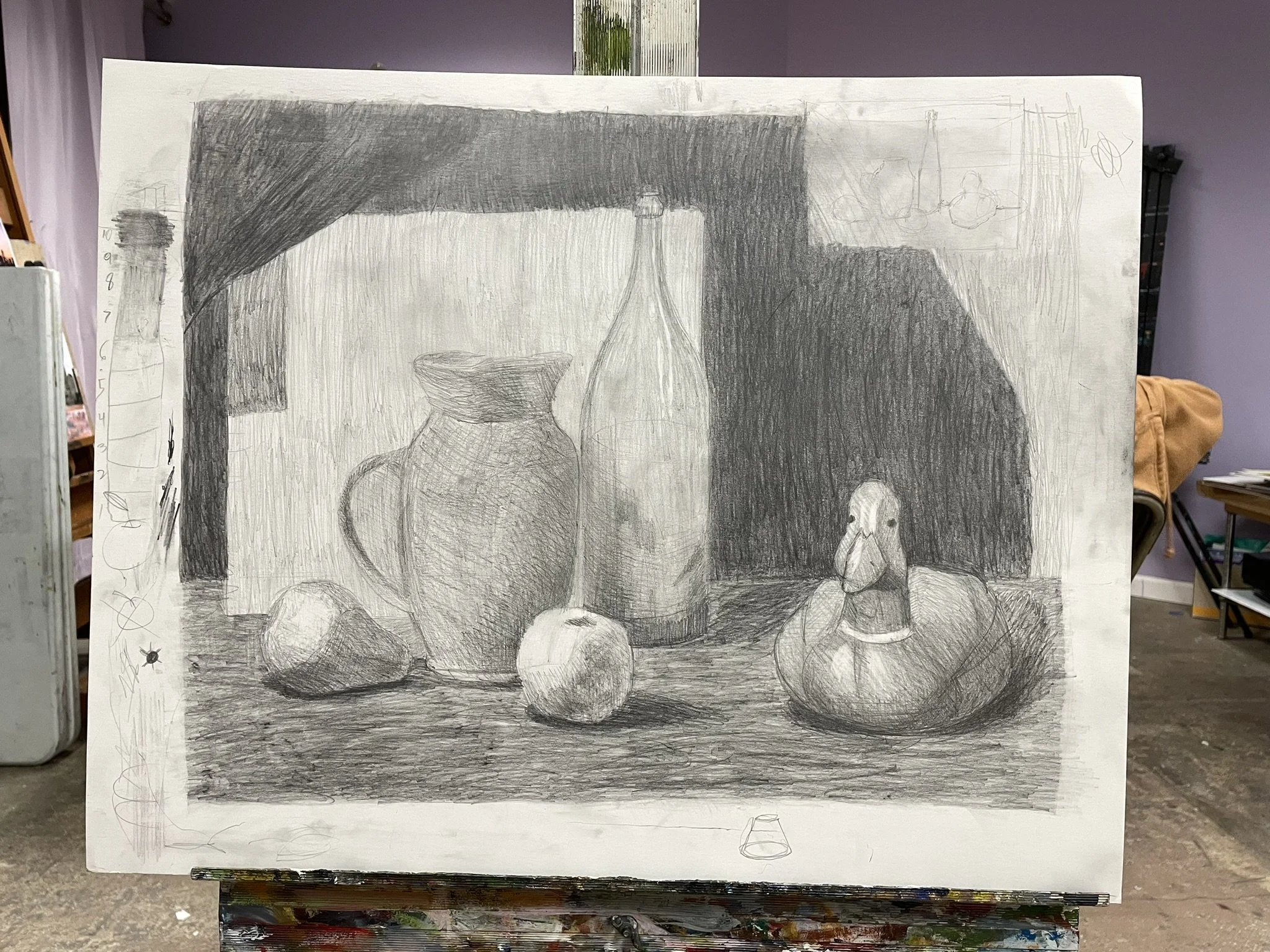 A pencil drawing of a still life arrangement featuring two large vases, a wine bottle, a pear, an apple, and a pumpkin with a face. The objects are on a textured surface with a dark background on the right side and a window or light source in the upp