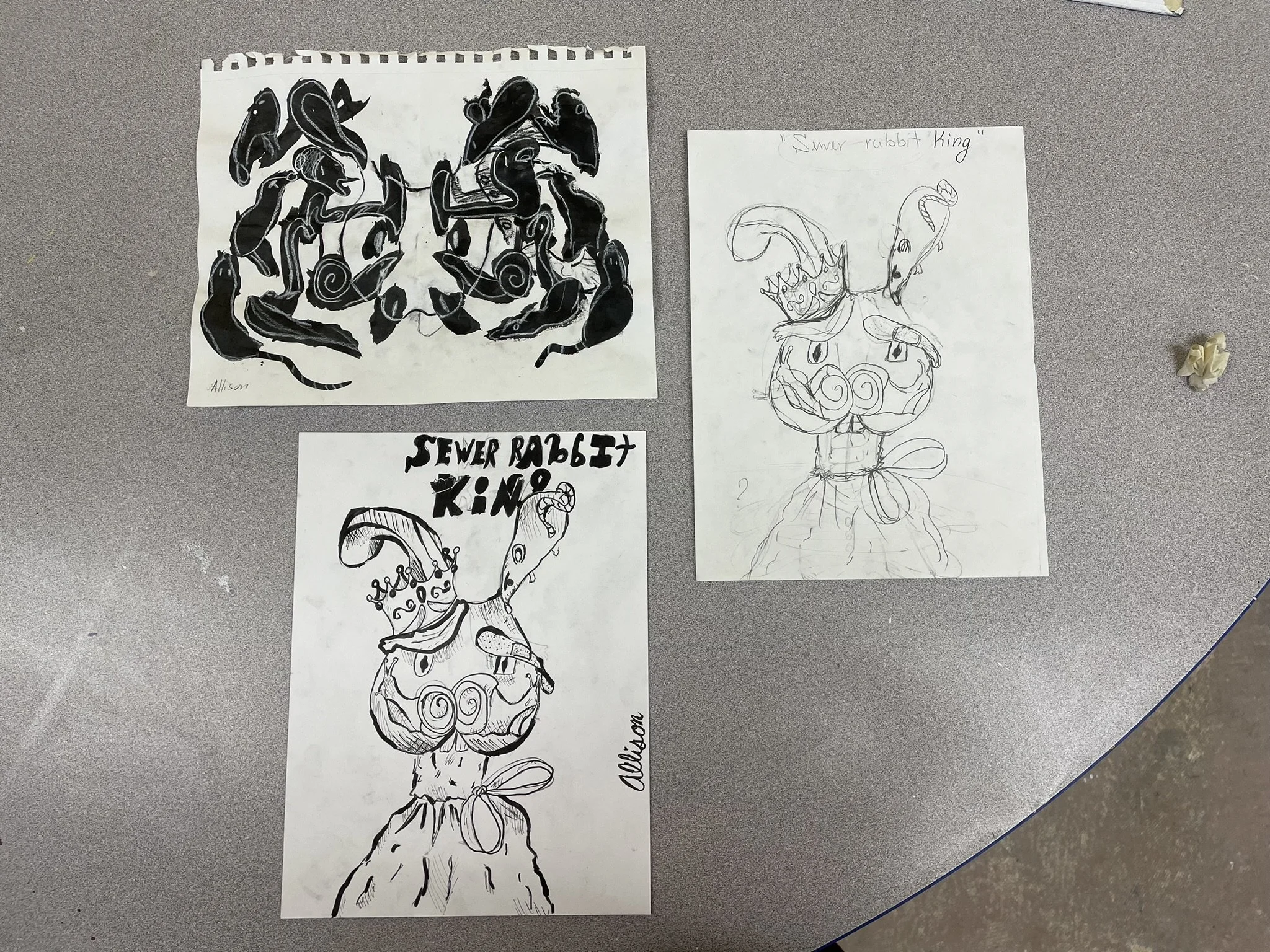 Three hand-drawn illustrations of a character called 'Sewer Rabbit King.' The top left drawing shows a black-and-white abstract design with multiple rabbits. The bottom left drawing depicts a rabbit wearing a crown with the text 'Sewer Rabbit King' a