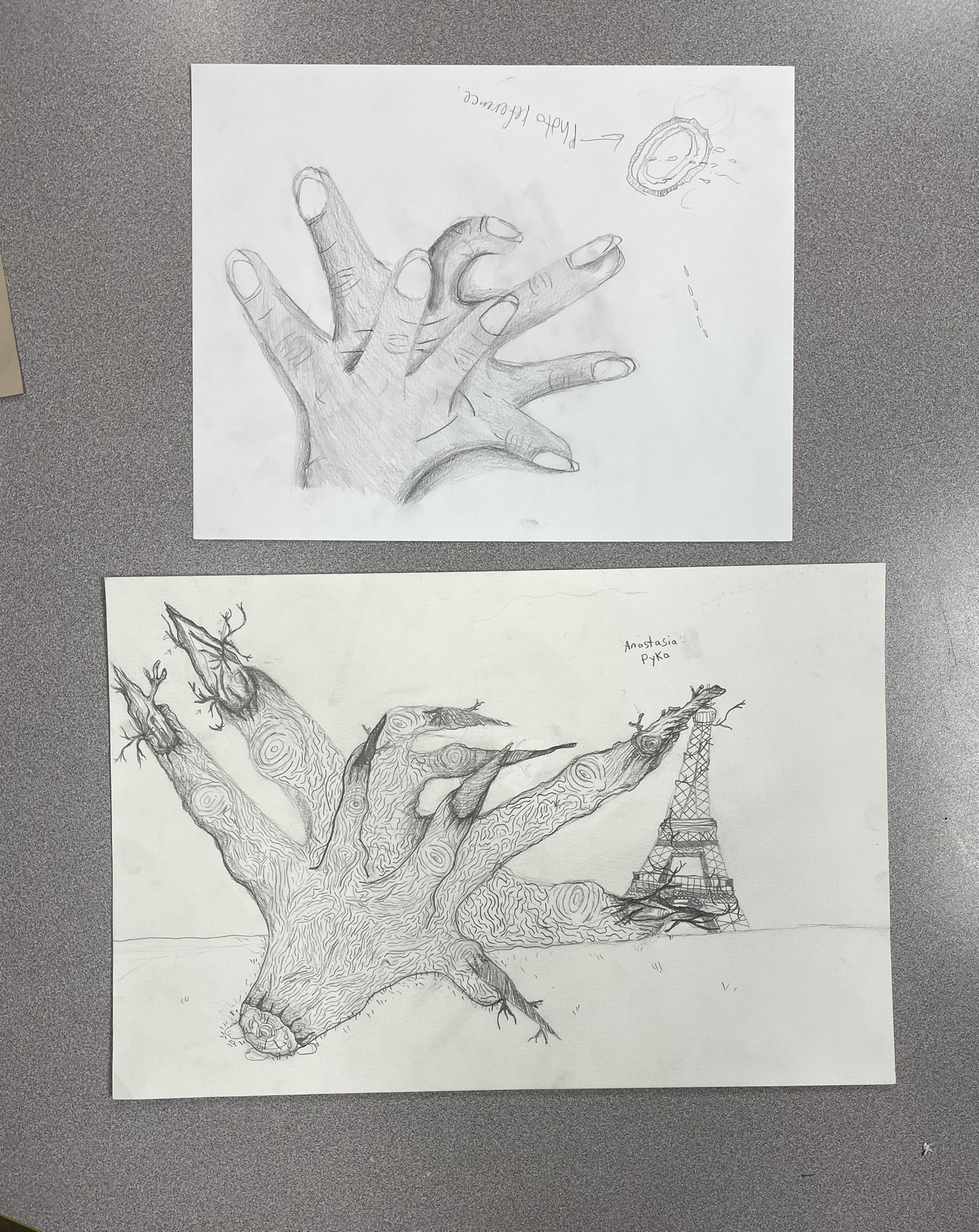 Two pencil sketches on white paper. The top sketch shows a detailed hand with fingers extended and a small drawing of a flying apple with a bite taken out labeled 'Pink Fluffy'. The bottom sketch features a realistic tree with a European-style tower 