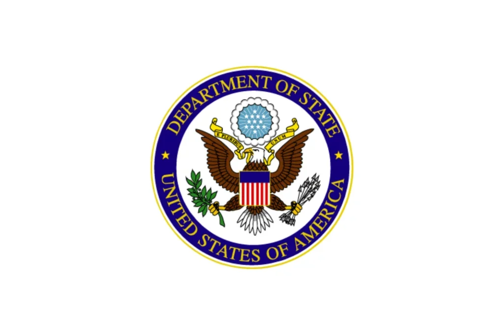 Seal of the U.S. Department of State featuring an eagle holding an olive branch and arrows, with a shield on its chest and a banner in its beak reading "E Pluribus Unum."