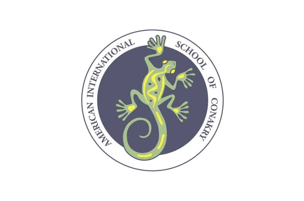 Logo of the American International School of Conakry featuring a green and yellow gecko inside a circular border.