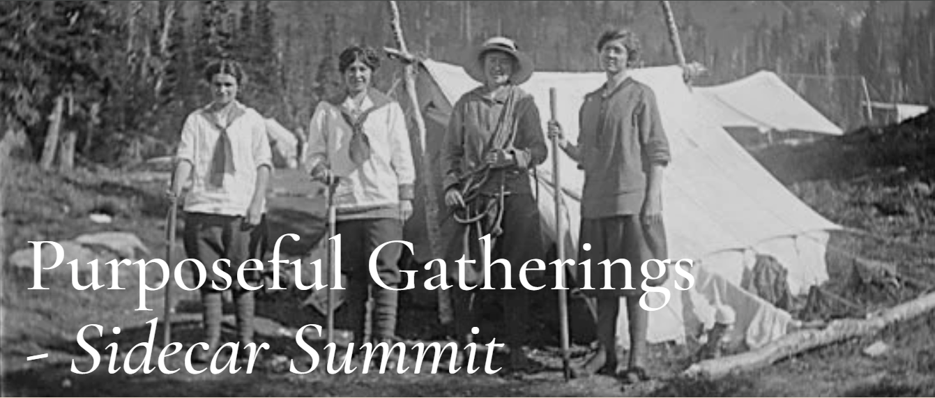 Historical black and white photograph of four women outdoors in front of a tent, dressed in vintage clothing, with some holding hiking sticks, in a remote natural setting.