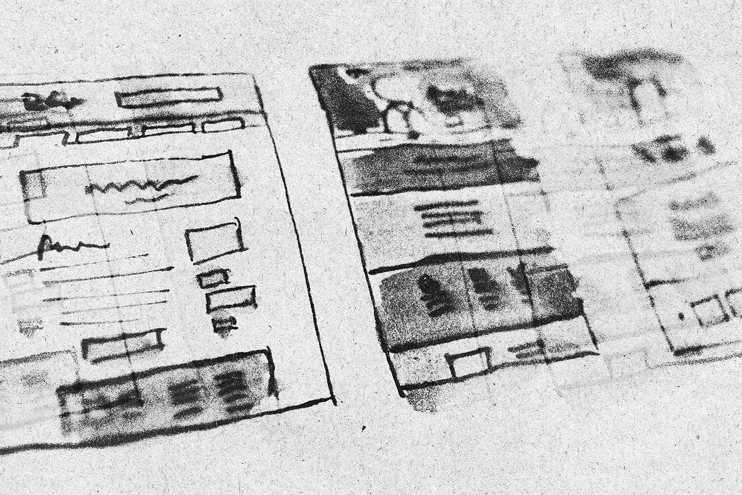 Black and white sketch of a mobile device screen with a layout of icons, text blocks, and a rectangular area, alongside another blurry screen with text and images.