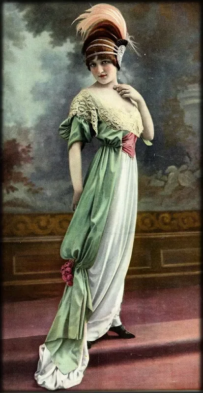 A woman wearing an elaborate costume with a large feathered headpiece, standing in front of a painted backdrop.